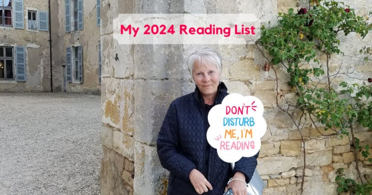 Mary Emmer standing in front of castle with Reading List 2024 in red